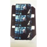 A signed limited edition coloured photographic print by Jonas Mekas of Andy Warhol holding an Oscar,