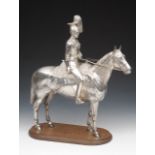 An early 20th century well detailed cast and silver plated equestrian figure group of soldiers