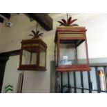 A pair of Georgian style decorative hanging lanterns of square form with glazed and pierced brass