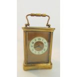A lat 19th century carriage clock in brass with 8 day timepiece