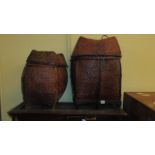 A pair of Chinese wicker baskets and covers complete with lids