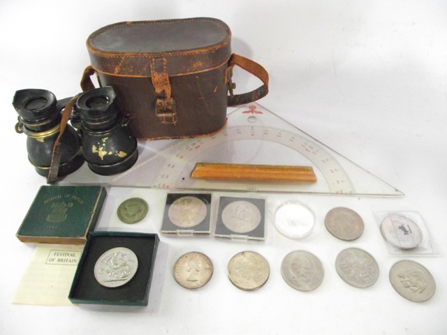 A collection of Crowns, mainly Elizabeth II, a pair of vintage binoculars and a WWII German military