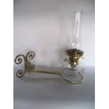 An antique oil burning lamp with clear glass fount and Eltex burner, set within a good quality