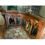 A reclaimed Victorian pitch pine ecclesiastical rail with pierced gothic tracery detail and