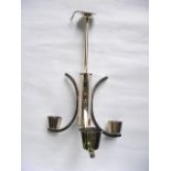 A brass three sconce ceiling light, loosely in the Art Deco manner with C shaped branches