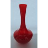 A striking 20th century Italian Glass vase in a red colourway of bulbous form with drawn neck,