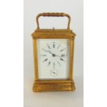 A 19th century brass carriage clock in an engraved Gorge case with 8 day striking movement and alarm