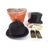 A 19th century tan leather hat box containing a gentleman's black felt top hat labelled to