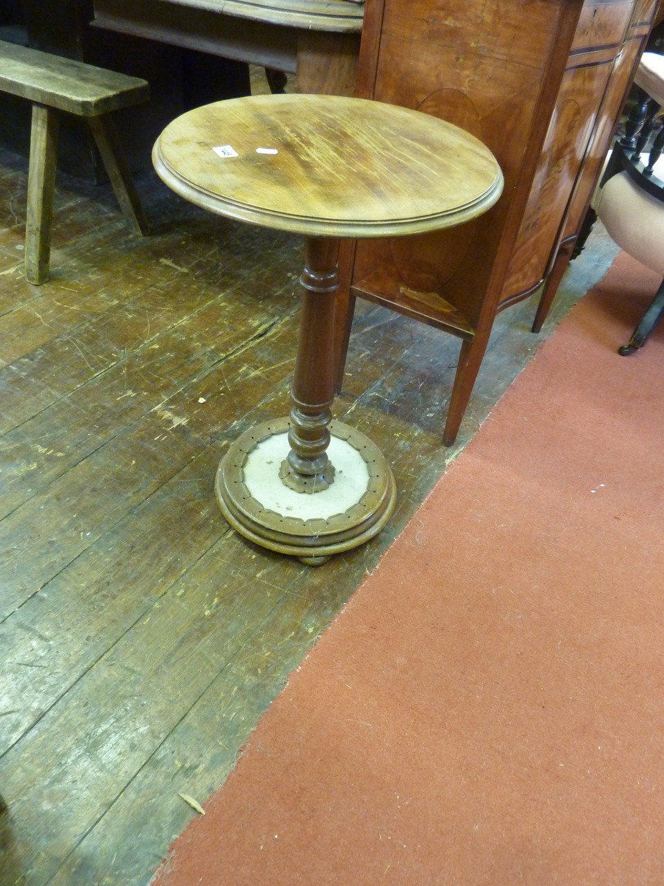 A mid Victorian mahogany occasional table, the circular top raised on a turned pillar and base,