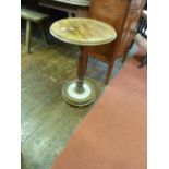 A mid Victorian mahogany occasional table, the circular top raised on a turned pillar and base,
