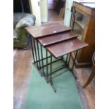 A nest of three Edwardian mahogany occasional tables of rectangular form in the Georgian manner,