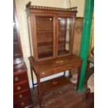 An inlaid Edwardian mahogany side cabinet, the table base fitted with two frieze drawers, raised