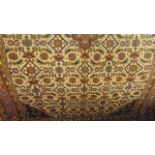 A heavy, deep wool rug, the central cream ground interspersed with complicated foliate and other