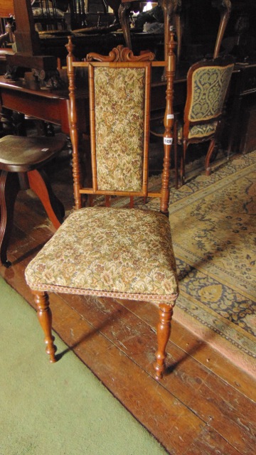A Victorian rosewood side chair with turned supports, upholstered seat and back panel