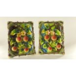 A pair of continental plaques of rectangular form with majolica type glazed finish and realistically