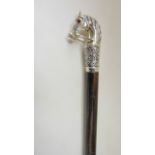 An Italian walking stick with cast white metal finial handle in the form of a horses bust (marked