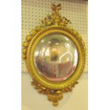 A good quality gilt brass convex framed mirror, with acanthus and scroll detail with cut stone
