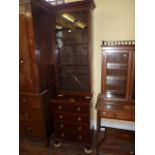 A 19th century mahogany side cabinet, the lower section enclosed by four frieze drawers, the upper