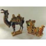 An oriental model of a carriage drawn by a pair of horses and with driver and single occupant,