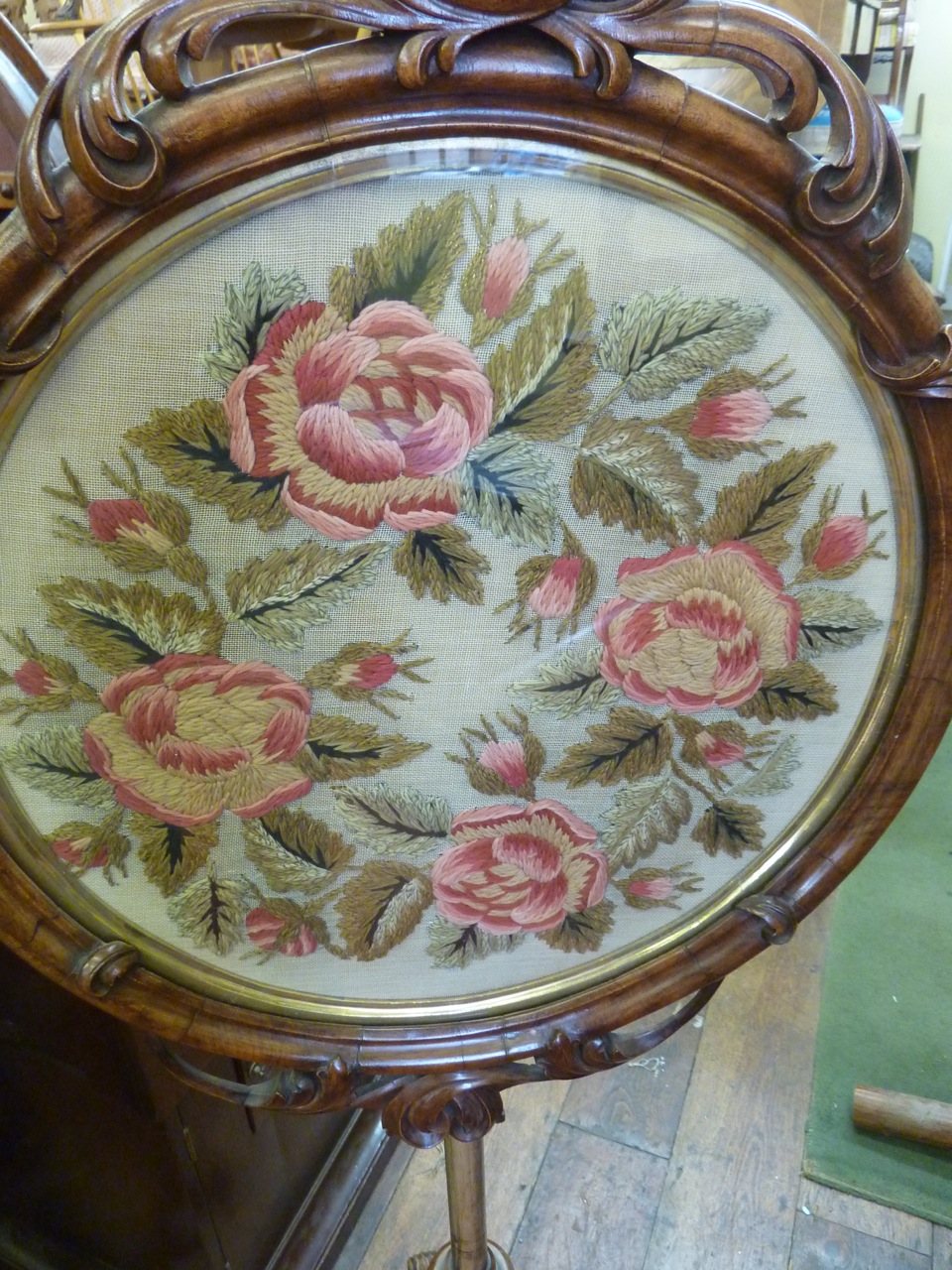 A Victorian walnut pole screen, the circular panel incorporating a drawn woolwork frieze of roses - Image 2 of 2
