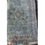 A contemporary silk work carpet in the Eastern manner with central cream field decorated with