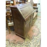 A Chinese rosewood writing bureau, the fall flap enclosing a simply fitted interior over two drawers