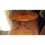 A Victorian walnut and burr walnut loo table with well matched veneers, the oval top raised on a