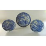 A late 19th century oriental blue and white charger with male and female character decoration in a