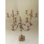 A good quality silver plated lighting trio comprising a sectional five branch candelabra with fluted