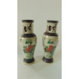 A pair of early 20th century oriental vases with pronounced crackle glazed finish, pheasant and