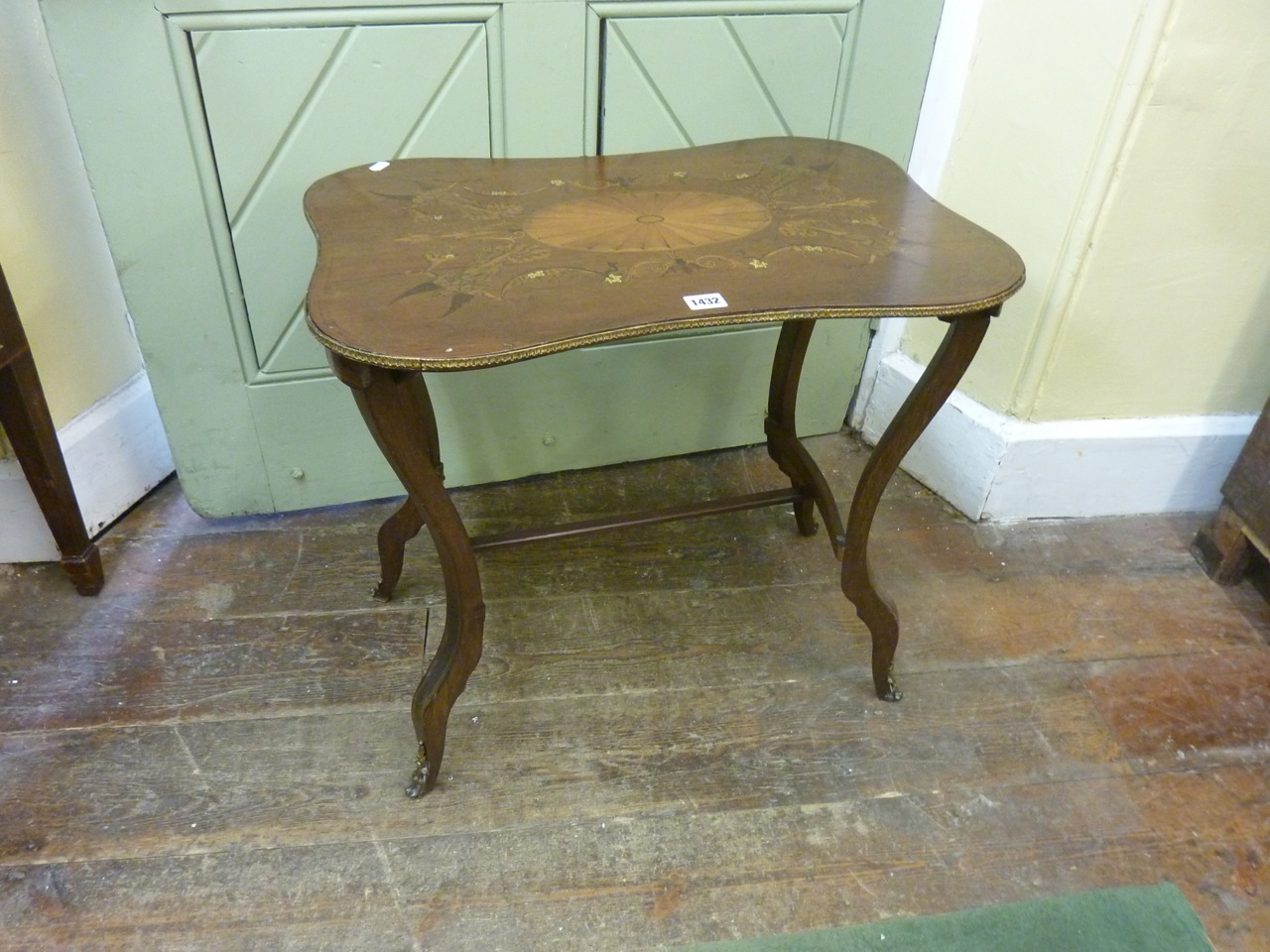A 19th century mahogany occasional table the rectangular top of waisted form with extensive