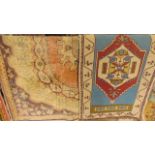 A small woven wool Eastern rug/mat with central medallion detail on a sky blue field set within a