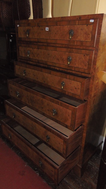 A good quality Art Deco burr walnut chest of six long graduated drawers crossbanded in yew wood with