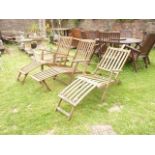 A pair of contemporary folding hardwood steamer type garden armchairs with slatted seats, backs