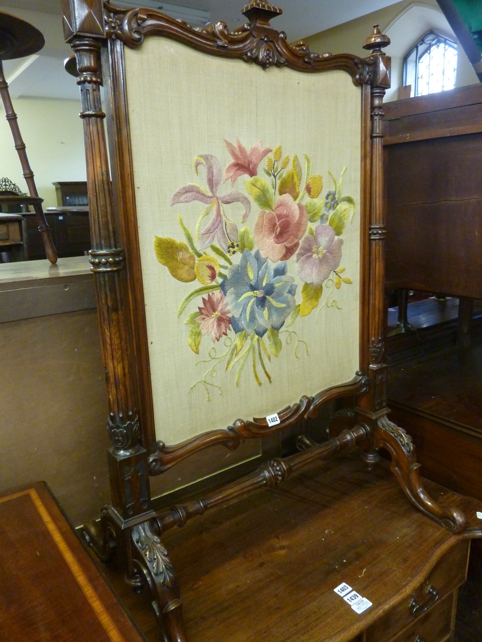 A good quality mid-Victorian walnut framed fire screen with turned, tapering and fluted column