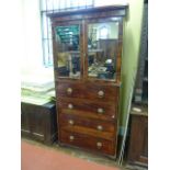 A Georgian mahogany gentleman's bedroom cabinet, the lower section enclosed by four drawers, the