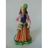 An unusual 19th century Staffordshire theatrical figure of a pink jacketed female character in hat