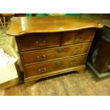 A small early 19th century teakwood chest of two long and two short drawers with pronounced and