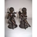 A pair of good quality 19th century cast bronze studies of Putti, both seated, one toiling over a