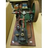 A scratch built scale model of a stationary engine, with single fly wheel, and two levers, etc,