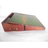 A 19th century mahogany veneered writing slope with brass lock escutcheon and looping carrying