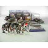 A boxed containing a selection of highly detailed hand painted model military tanks by Corgi