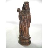 A good quality antique oak carved icon in the form of The Madonna and Child, crowned, carved in