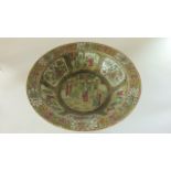 A large 19th century Cantonese basin with polychrome painted decoration to the interior