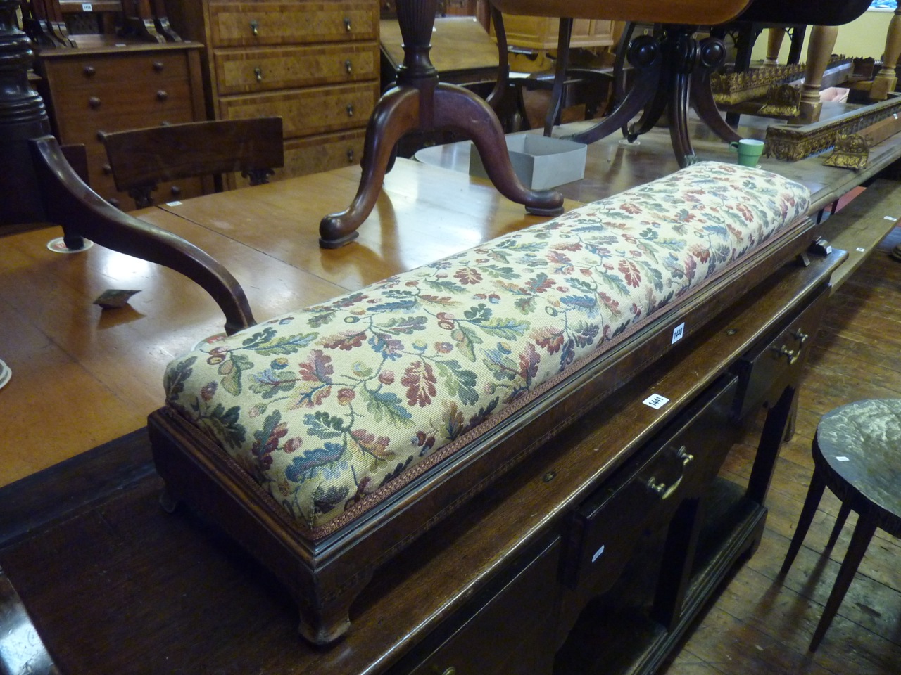 A Victorian figured walnut foot/hearth stool with marquetry inlay detail and upholstered top, 120 cm