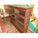 A Globe Wernicke side-by-side bookcase incorporating six glazed up-and-over doors, 138cm wide, of