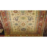 A good quality contemporary wool rug, the central cream field interspersed with multiple medallions,