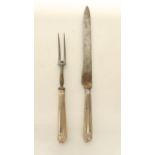 A Victorian silver-handled carving knife and fork, Chawner & Co., London, 1872, each with shell