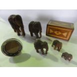 A 19th century inlaid mahogany caddy, three carved Indian elephants and a circular silver photograph
