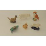 A collection of Beswick items including a model of a white pig marked to base CH Wall Boy, a barn